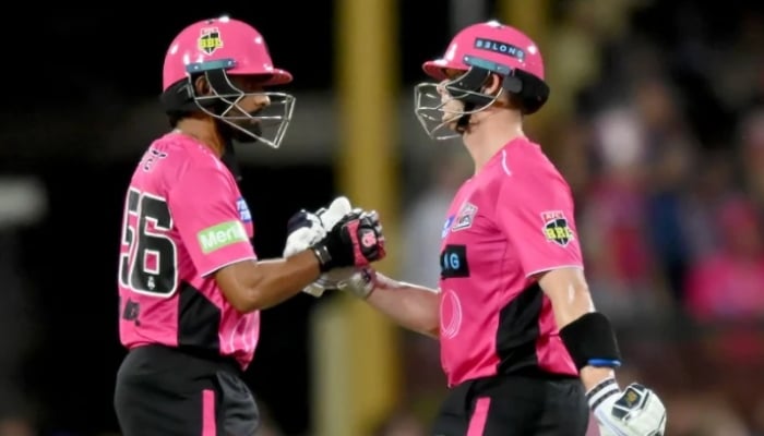 Steve Smith of Sydney Sixers is congratulated by his teammate Babar Azam after completing his half-century (50 runs) during the BBL match between Sydney Sixers and Sydney Thunder at the Sydney Cricket Ground, on January 16, 2026, in Sydney, Australia. — AFP