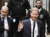 Prince Harry waves and receives good luck cheers on day two of trial