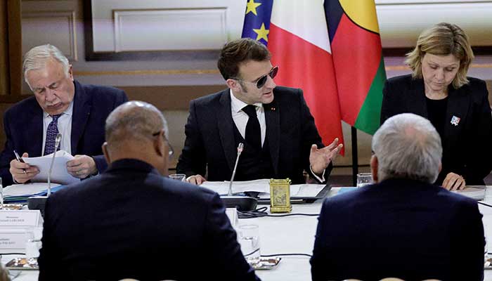 French President Emmanuel Macron, flanked by the National Assemblys President Yael Braun-Pivet and the Senates President Gerard Larcher, gestures as he leads a meeting on New-Caledonia at the Elysee Palace in Paris, France, January 19, 2026. — Reuters