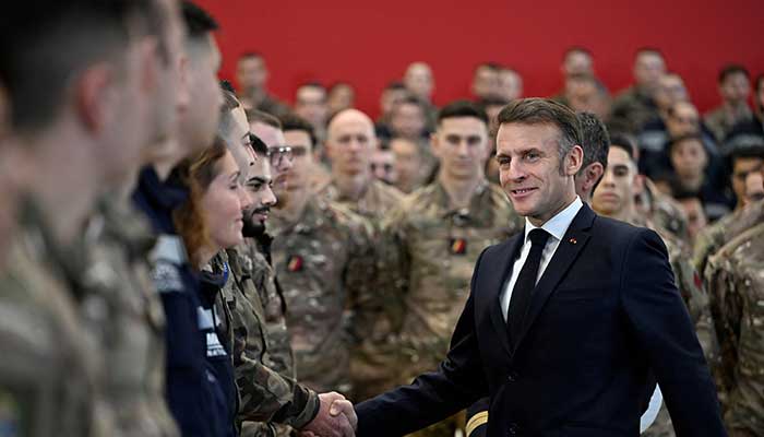 French President Emmanuel Macron shakes hands with soldiers as he visits the Istres military air force base, southern France, January 15, 2026. — Reuters
