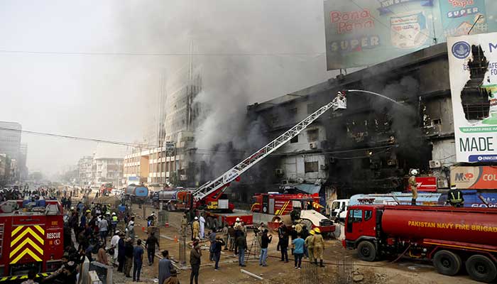 Smoke rises as firefighters spray water to extinguish a massive fire that broke out in the Gul Plaza Shopping Centre building, in Karachi, Pakistan, January 18, 2026. — Reuters