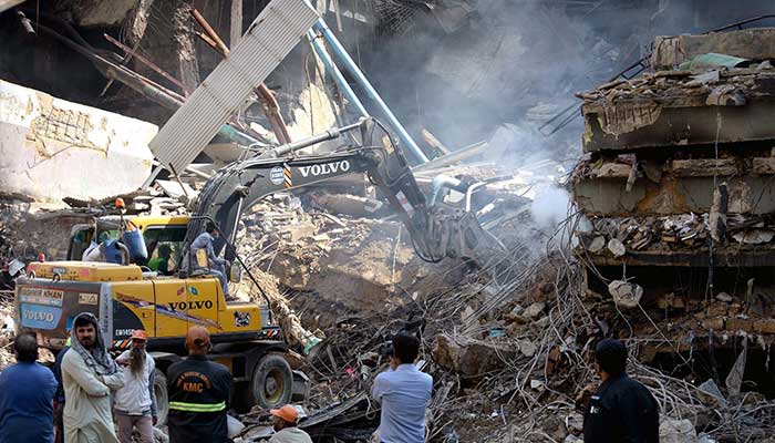 View of Gul Plaza after fire, with heavy machinery and rescue teams operating at MA Jinnah Road, Karachi, January 20, 2026. — PPI
