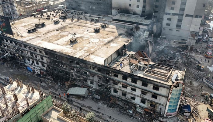 An aerial view shows the charred remains of Gul Plaza hopping mall after a massive fire in Karachi on January 21, 2026. — AFP