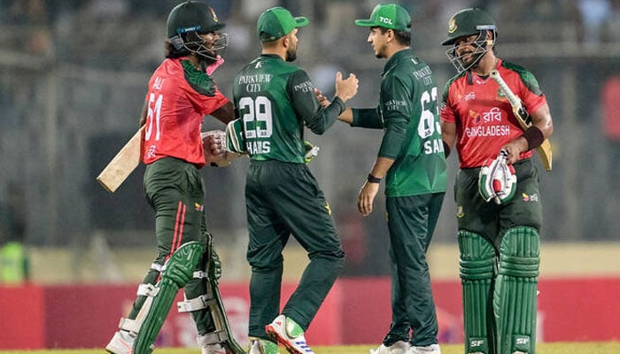 Pakistan and Bangladeshi players shake hands during a match. — AFP/File