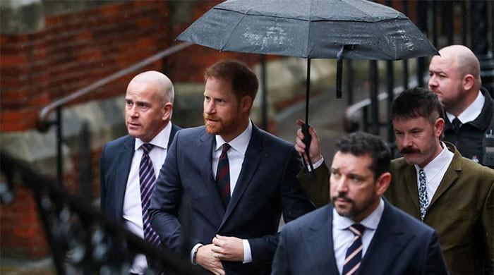 Prince Harry fights back tears to stand with others in legal battle