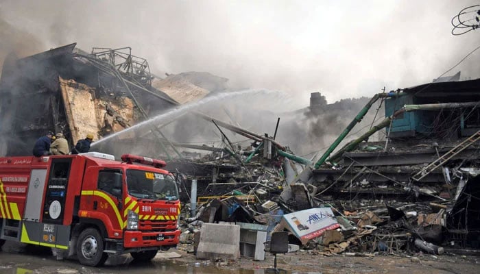 Fire fighters douse Gul Plaza fire to control a fire which broke out at Gul Plaza shopping centre in Karachi on January 18, 2026. — Online