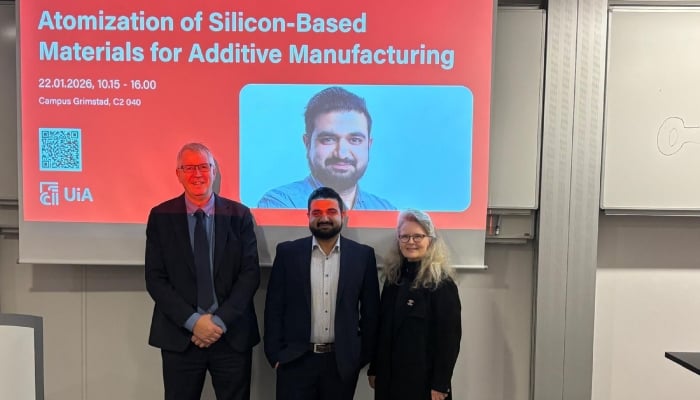 Dr Muhammad Ibrahim poses with university officials at the panel discussion for thesis defence. — Geo.tv