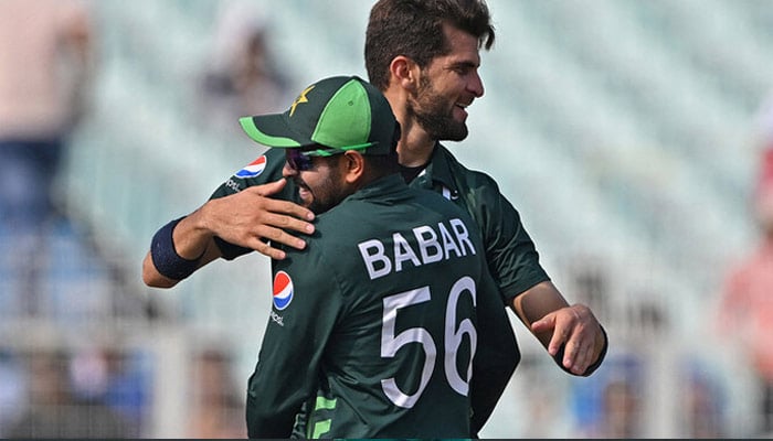 Shaheen Shah Afridi (right) celebrates with Babar Azam after taking the wicket of Bangladesh’s Tanzid Hasan during the 2023 ICC Men’s Cricket World Cup one-day international (ODI) match between Pakistan and Bangladesh at the Eden Gardens in Kolkata on October 31, 2023. — AFP