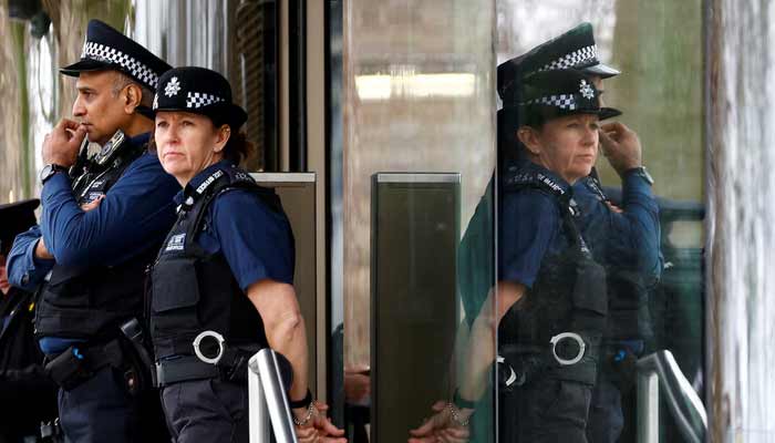 Police officers stand outside New Scotland Yard, the headquarters of the Metropolitan Police, in London. — Reuters/File