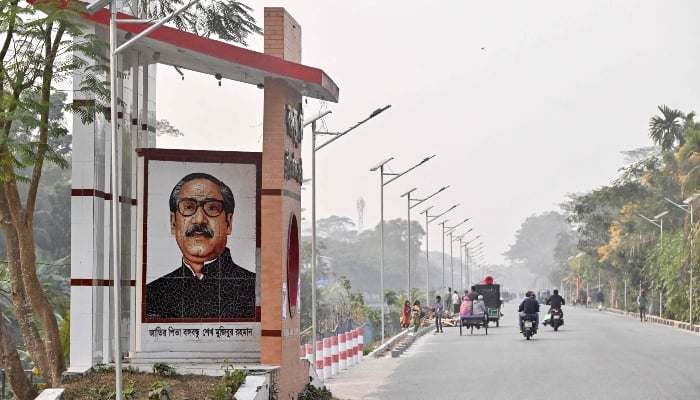 This photograph, taken on January 14, 2026, shows a mosaic featuring Sheikh Mujibur Rahman, Bangladeshs first president and father of ousted prime minister Sheikh Hasina, displayed along a street at Tungipara village, his birthplace in Gopalganj. — AFP