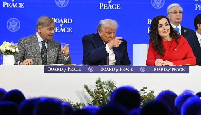 (From left to right) Prime Minister Shehbaz Sharif, US President Donald Trump and Kosovos President Vjosa Osmani gesture at the Board of Peace meeting during the World Economic Forum (WEF) annual meeting in Davos on January 22, 2026. — Reuters