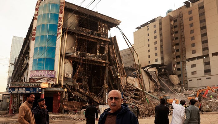 Muhammad Imran, 56, a crockery shop owner who survived, looks on following a massive fire that broke out in the Gul Plaza shopping centre in Karachi on January 23, 2026. — Reuters