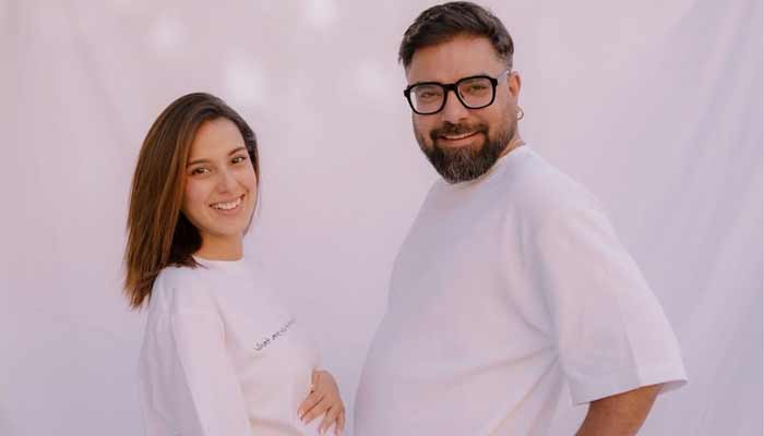 Pakistani actors Iqra Aziz and Yasir Hussain pose with a baby bump in a picture shared in November 2025. — Instagram/@Iqraaziz
