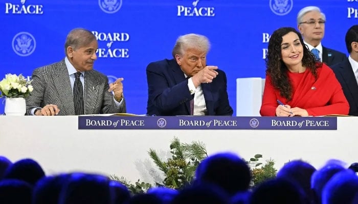 (From left to right) Prime Minister Shehbaz Sharif, US President Donald Trump and Kosovos President Vjosa Osmani gesture at the Board of Peace meeting during the World Economic Forum (WEF) annual meeting in Davos on January 22, 2026. — Reuters