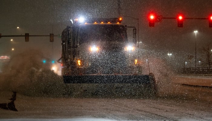 A vehicle equipped with a snowplough clears snow as Winter Storm Fern arrives in Oklahoma City, Oklahoma, US, January 23, 2026. — Reuters