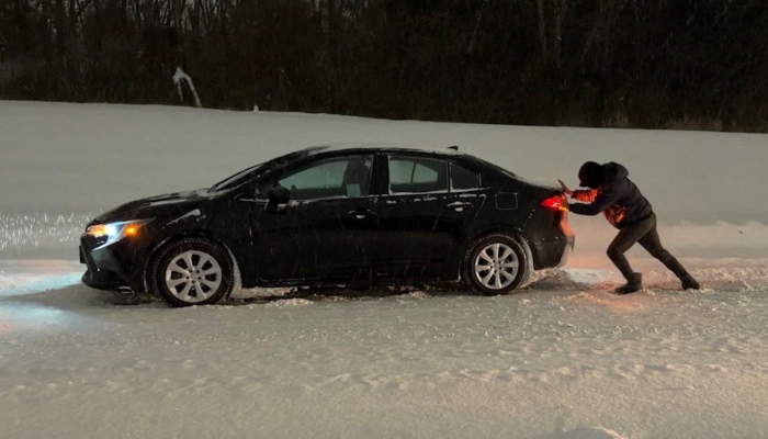 A man pushes his car amidst snowfall as Winter Storm Fern leaves drivers stranded in Tulsa, Oklahoma, January 25, 2026, in this screen grab from video. — Reuters