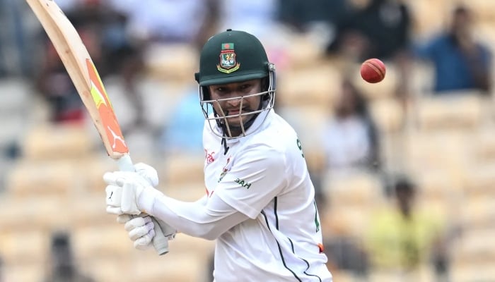 Shakib Al Hasan batting while biting a strap, India vs Bangladesh, 1st Test, 4th day, Chennai, September 22, 2024. — AFP