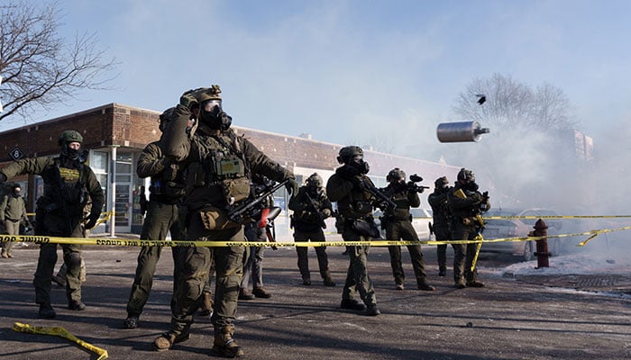 A federal agent throws a canister of teargas near the site where a man identified as Alex Pretti was fatally shot by federal agents trying to detain him, in Minneapolis, Minnesota, US on January 24, 2026. — AFP