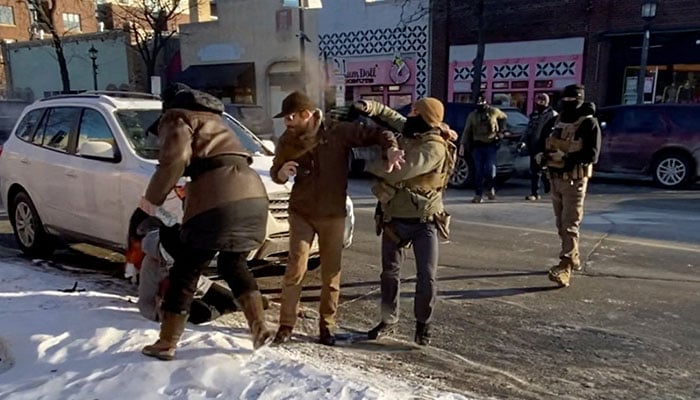 A screengrab from a video obtained by Reuters shows a law enforcement officer spraying irritants at a man identified as Alex Pretti, before he was fatally shot when federal agents were trying to detain him in Minneapolis, Minnesota, US on January 24, 2026. — Reuters