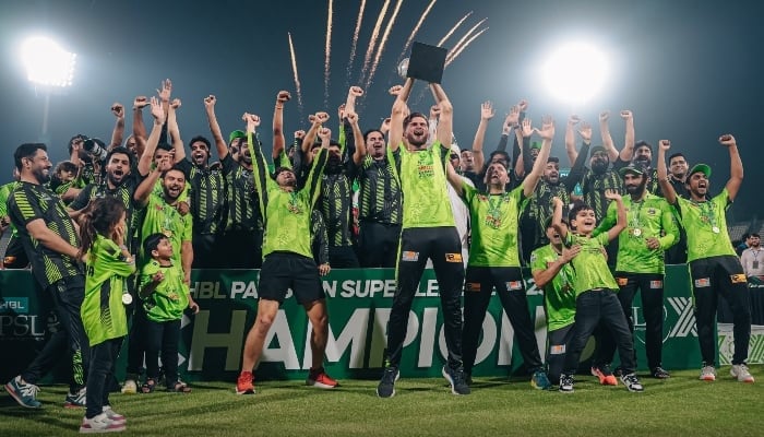 Lahore Qalanders captain Shaheen Shah Afridi (centre) celebrates with the trophy with players during the victory ceremony at the end of PSL X final at the Qaddafi Cricket Stadium in Lahore on May 25, 2025. — X/@lahoreqalandars