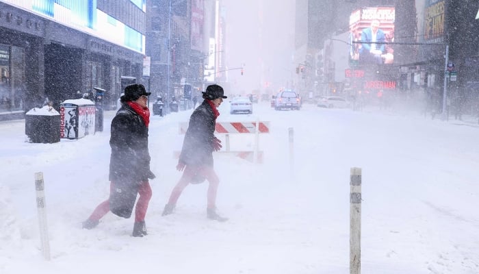 Historic winter storm kills at least 10 across US 11 People walk across Sixth Avenue as snow falls in New York City, US, on January 25, 2026. — AFP