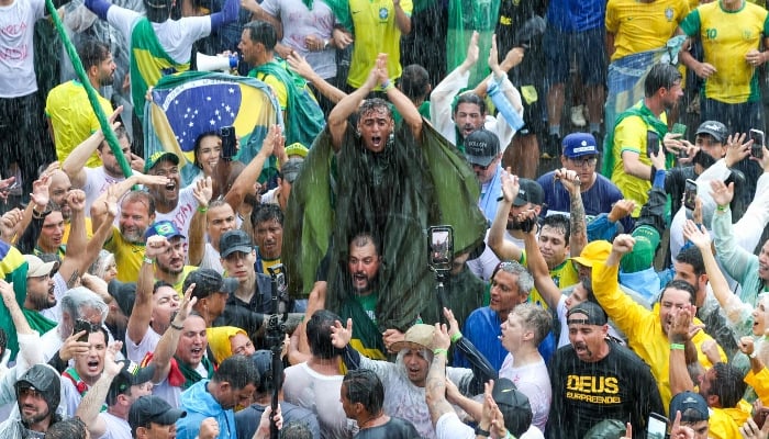 Brazilian Federal Deputy Nikolas Ferreira gestures among supporters of former president Jair Bolsonaro during a march in Brasilia on January 25, 2026. — AFP