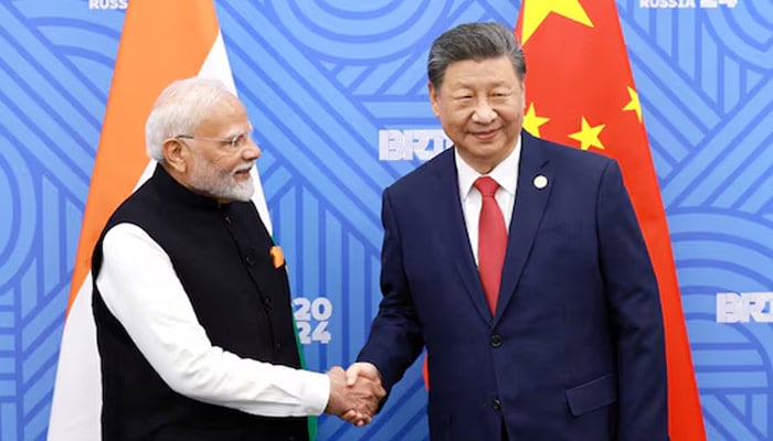 Chinese President Xi Jinping and Indian Prime Minister Narendra Modi meet on the sidelines of the BRICS summit in Kazan, Russia October 23, 2024. — Reuters