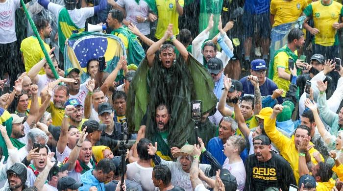 Lightning strike injures almost 100 at rally for Brazil's former president