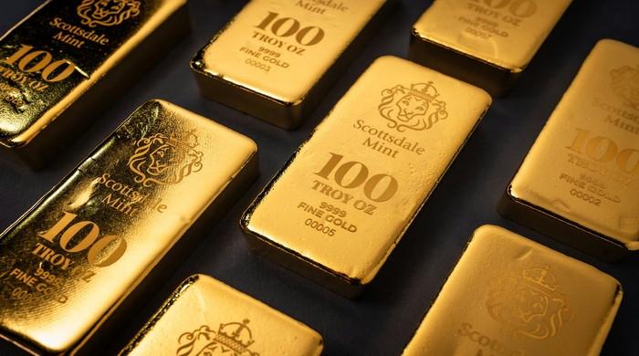Gold surges to historic $5,000 mark per ounce: What's driving yellow metal so high?