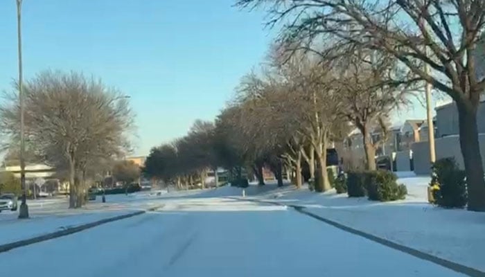 A view of a snow-covered road in Texas, US. — Reporter