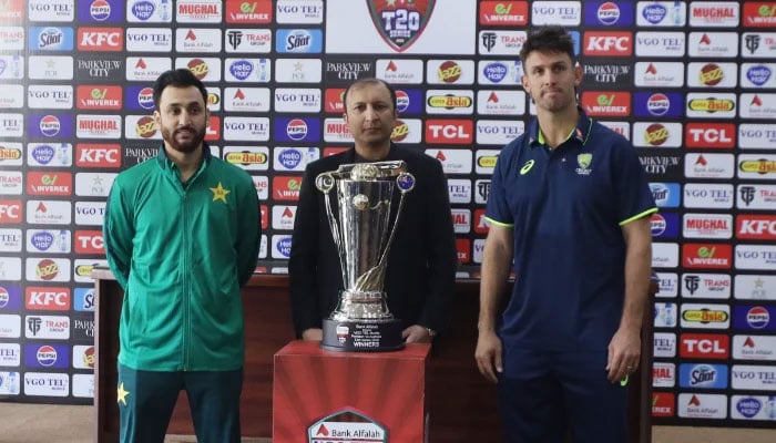 Pakistan T20I captain Salman Ali Agha (left) and Australia’s Mitchell Marsh pictured with the T20I series trophy at Gaddafi Stadium in Lahore on January 28, 2026 — PCB