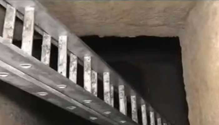 The image shows ladder set in a gutter where a woman, along with her daughter, allegedly fell in Lahore on January 28, 2026. — Geo News/Screengrab