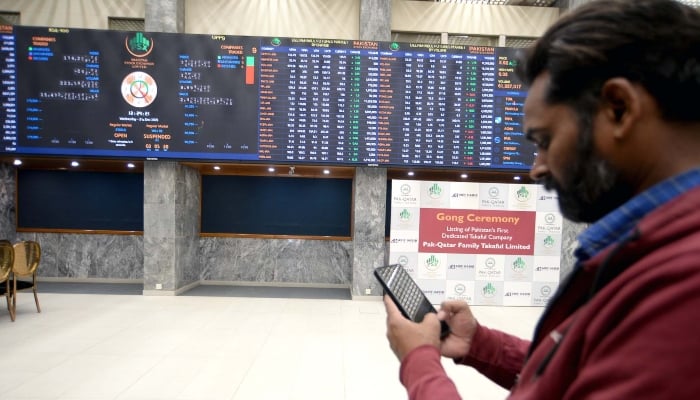 Broker is busy in trading at Pakistan Stock Exchange (PSX) in Karachi on Wednesday, December 31, 2025. — PPI