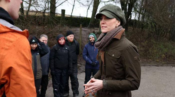 Princess Kate caught laughing in a muddy puddle