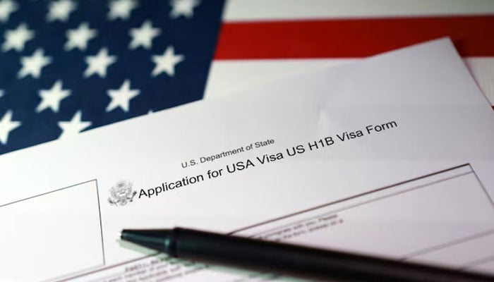 A US flag and a US H-1B Visa application form are seen in this illustration taken, September 22, 2025. — Reuters