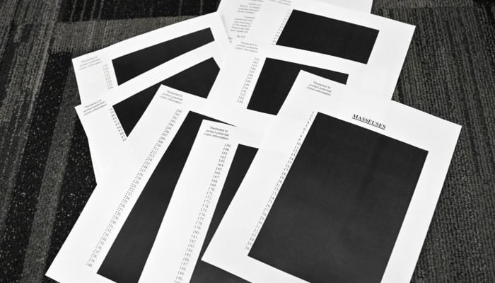 Redacted documents after the US Justice Department began releasing the long-awaited records from the investigation into the politically explosive case of convicted sex offender Jeffrey Epstein. — AFP