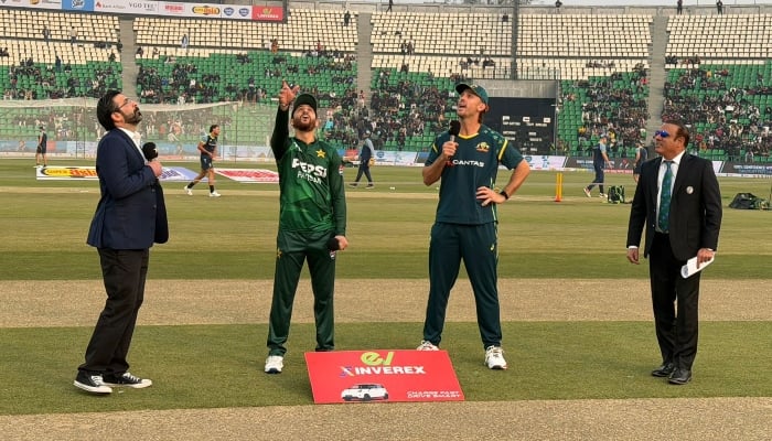 Pakistan captain Salman Ali Agha (second from left) flips the coin as Australia’s Travis Head (second from right) calls it at the toss for the first T20I match at Gaddafi Stadium, Lahore, on January 31, 2026. — PCB