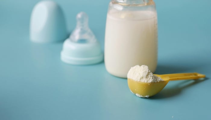 Representational image shows close-up shot of a scooped formula milk powder. — Pexels