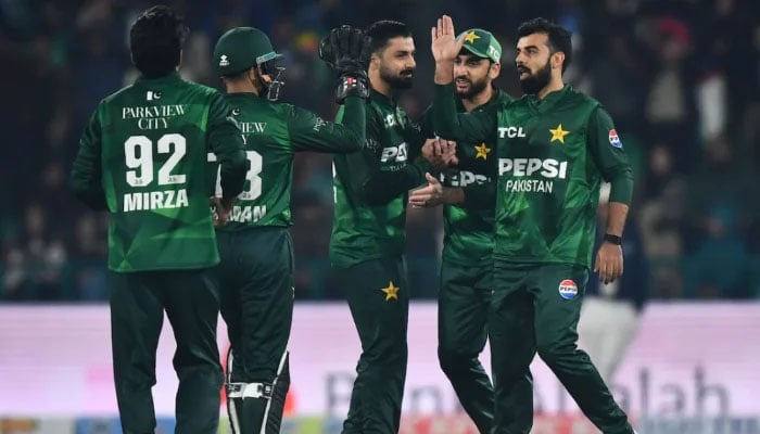Pakistan cricket players celebrate during the first T20I match against Australia at the Gaddafi Stadium in Lahore on January 29, 2026. — PCB