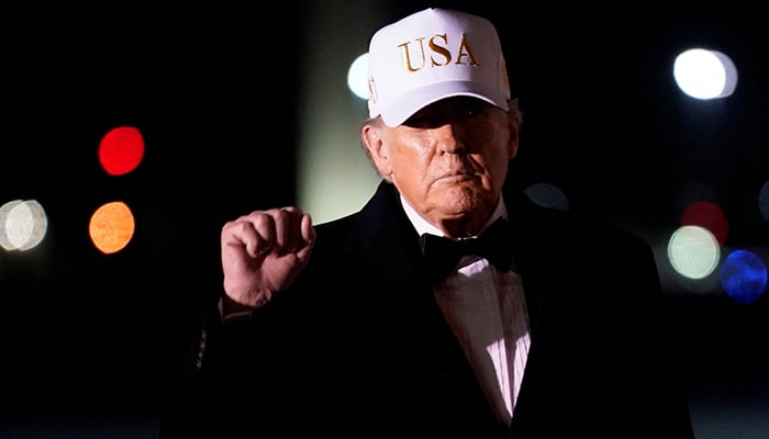 US President Donald Trump gestures after disembarking from Air Force One on his arrival at Palm Beach International Airport in West Palm Beach, Florida, US, January 31, 2026. — Reuters