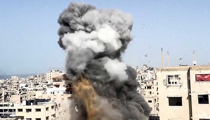 Smoke rises after a projectile fell on a building during an Israeli airstrike on Saturday, in Gaza City, January 31, 2026, in this screengrab from a video. — Reuters