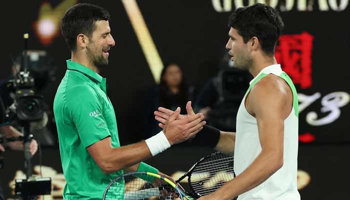 Spanish Tennis player Carlos Alcaraz shakes hands with Serbian great Novak Djokovic after winning his first Australian Open on February 1, 2026. — Instagram /@australianopen