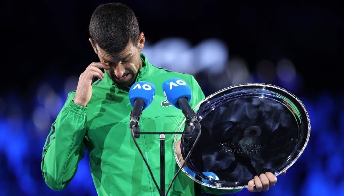 Serbias Novak Djokovic speaks after receiving the runner-up shield following his defeat to Spainâ€™s Carlos Alcaraz in the menâ€™s singles final on Day 15 of the Australian Open tennis tournament in Melbourne on February 1, 2026. — AFP