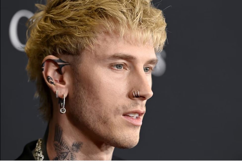 Machine Gun Kelly flaunts new ink at Clive Davis pre-Grammys party
