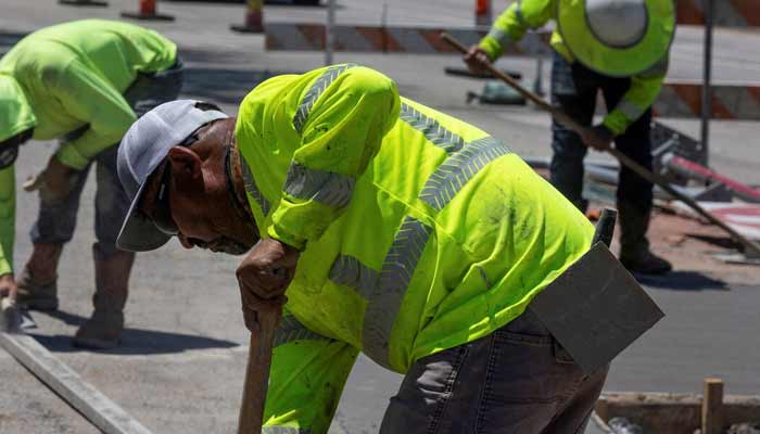 A representational image of labours working on roadside. — Reuters
