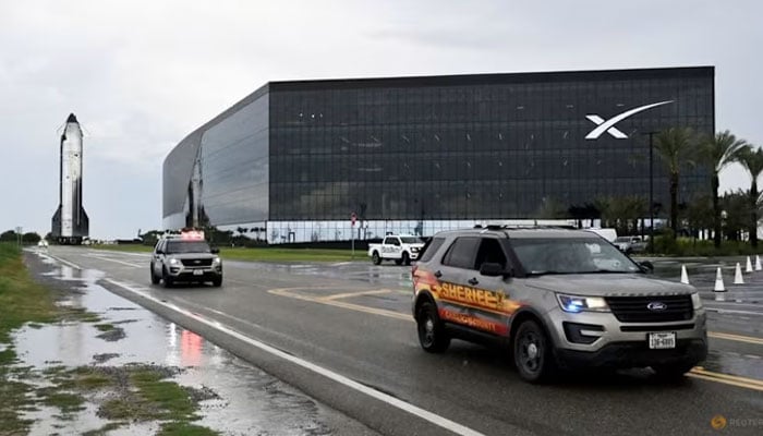 A SpaceX Starship spacecraft rolls out toward its launch pad past the Starbase Manufacturing Facility before its 10th test flight from the companys complex in Starbase, Texas, U.S., August 23, 2025. — Reuters