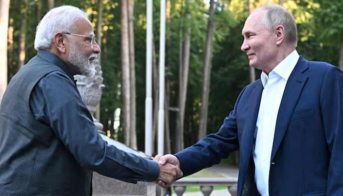 Russias President Vladimir Putin shakes hands with Indias Prime Minister Narendra Modi during their meeting at the Novo-Ogaryovo state residence near Moscow, Russia. — Reuters