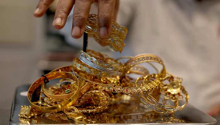 A representational image of Gold on weight machine. — Reuters/File