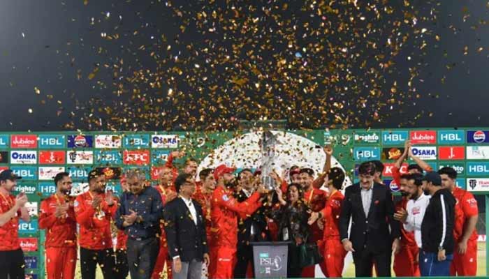 Islamabad United captain Shadab Khan lifts the Pakistan Super League (PSL) season nine title after beating Multan Sultans in the final in Karachi on March 18, 2024.— PCB