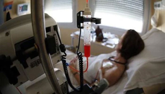 A patient receives chemotherapy treatment for breast cancer at the Antoine-Lacassagne Cancer Centre in Nice, France, on July 26, 2012. —Reuters